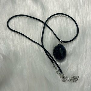 Rainbow fluorite pendant with rope necklace.